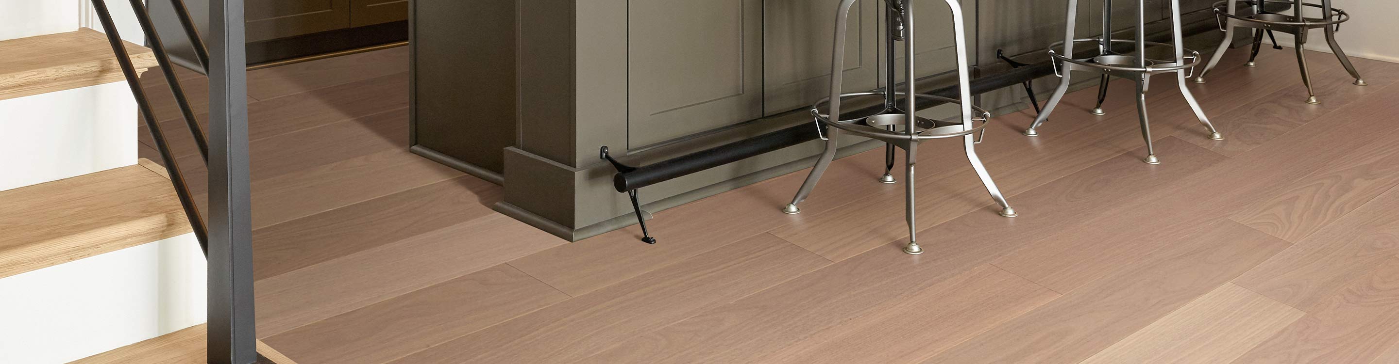 kitchen area with hardwood flooring and stairs